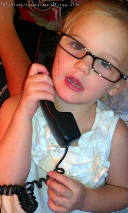 She is fascinated with the "curly phones" they have in hotel rooms.